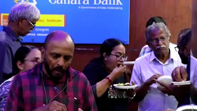 Canara Bank employees in Kochi protest alleged beef ban by serving beef outside office